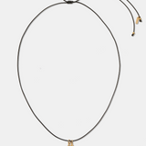 GOLDEN FISH CORD PENDANT - BLACK